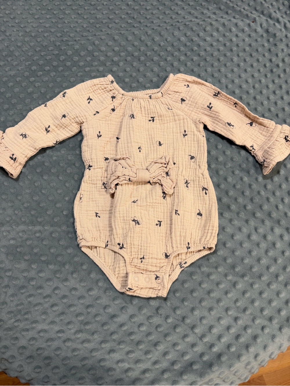 Soft Blush Long-Sleeve Baby One-Piece with Bow Accent